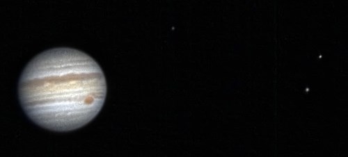 Jupiter and three of its moons Callisto, Ganymede and Io